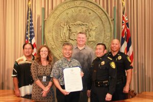 Governor David Ige issued a proclamation to initiate the Click It or Ticket campaign. From left to right: Ford Fuchigami, HDOT Director; Kari Benes, DOH Trauma System Public Health Educator; Governor David Ige; Greg Fredericksen, NHTSA Region 9 Deputy Administrator; Major Darren Izumo, Honolulu Police Department; Lieutenant William Gannon, Maui Police Department 