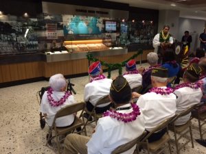 The distinguished veterans watch as the new Hawaii Nisei Veterans exhibit at the Honolulu International Airport is blessed by Kahu Wendell Davis.