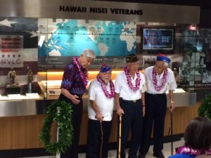 Honored veterans from left to right: Governor George Ariyoshi, Kenji Ego, Herbert Yanamura, and Robert Kishinami. 
