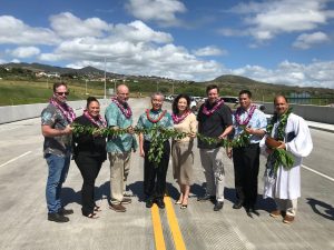 Untying of the maile lei by Ed Brown (Goodfellow Bros), Rep. Stacelynn Eli, Ralph Rizzo (Hawaii Division Administrator for FHWA), Gov. David Ige, Rep. Sharon Har, Steve Kelly (Kapolei Properties Division), Ed Sniffen (HDOT Highways Deputy Director), and Kahu Kordell Kekoa. Photo courtesy: "HDOT" or "Hawaii Department of Transportation".