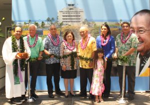 Kahu Kordell Kekoa (from left to right); Honolulu Mayor Kirk Caldwell; Gov. David Ige’s Chief of Staff Mike McCartney; Mrs. Irene Hirano Inouye; Ken Inouye, Sen. Inouye’s son; Maggie Inouye, Sen. Inouye’s granddaughter; U.S. Representative Tulsi Gabbard and State Senate President Ronald Kouchi participate in the traditional untying of the maile lei during the ceremony