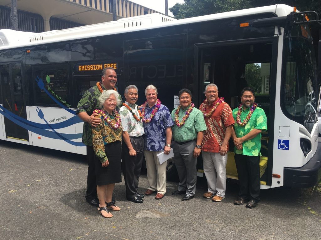 Hawaii State Energy Office Administrator Carilyn Shon; Proterra, Inc. Chief Commercial Officer Matt Horton; HDOT Director Jade Butay; Kauai Mayor Bernard Carvalho; Governor David Y. Ige; Hawaiian Electric General Manager Brennon Morioka; and City & County of Honolulu Department of Transportation Services Deputy Director Jon Nouchi stand in front of the Proterra bus.