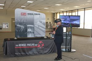 Governor David Ige experiences the virtual reality display by Hensel Phelps that shows what the Mauka Concourse will look like when it is built in 2020.
