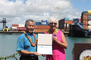 Lauren Brand, Associate Administrator for the Office of Ports &amp; Waterways with the Maritime Administration, presents Governor David Y. Ige with a certificate officially designating the waters around and between the Hawaiian Islands as Marine Highway "MH-1."
