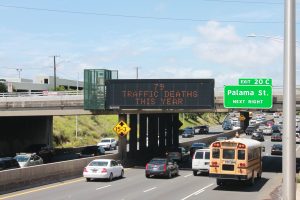 An example of a message board with the traffic death number displayed above the H-1 Freeway on the Liliha Street overpass