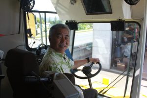 Governor David Ige sits in the driver's seat of the new Zipmobile.