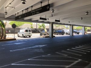 HDOT has created a dozen stalls reserved for over height vehicles next to the lot A construction fencing, behind the lei stand building and across from the ground level entrance to the International Parking structure.