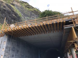 A new tunnel structure is being constructed before the existing Honolulu bound tunnel entrance to protect motorists. Work on the tunnel structure is anticipated to be completed in October 2019, weather permitting. Photo courtesy: HDOT or Hawaii Department of Transportation