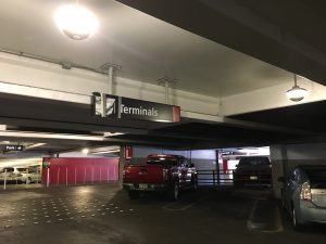 A sign in the Terminal 2 parking structure at HNL was recently damaged by an over height vehicle. Photo courtesy: “HDOT” or “Hawaii Department of Transportation”