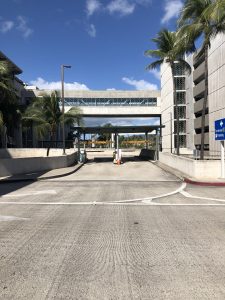 Monthly pass holders will use the left lane of the second level (departures level) makai entrance (pictured) into Terminal 1. The public may use either lane. Photo courtesy: “HDOT” or “Hawaii Department of Transportation”